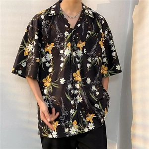 Retro Hawaiian shirt with yellow floral print on black fabric and loose fit design