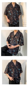 Detail of Hawaiian floral shirt showing ocean patterns like shells and starfish motifs