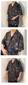 Close-up of Hawaiian short sleeve shirt with colorful starfish and seashell prints