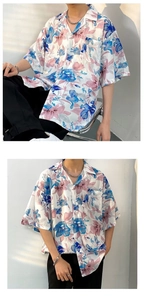 Detail of loose-fit summer Hawaiian shirt with blue and purple floral print patterns