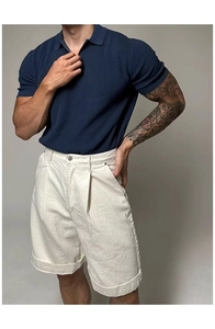 Detail of navy blue ribbed knit Polo shirt with premium zipper collar and short sleeves