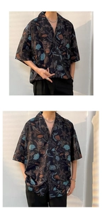 Close-up of beach shirt with starfish and shell patterns on smooth black ice silk fabric