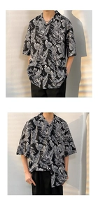 Detailed view of the draped leaf print on a loose-fit black summer resort shirt
