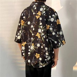 Detailed back view of a loose American retro floral shirt with yellow and white patterns