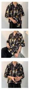 Detail of vintage floral pattern on loose Hawaiian short sleeve shirt with retro print
