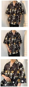 Detailed view of vintage floral shirt featuring retro yellow prints on black fabric