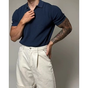 Slim fit men's dark blue knitted polo shirt with stylish metal half-zipper and ribbed texture