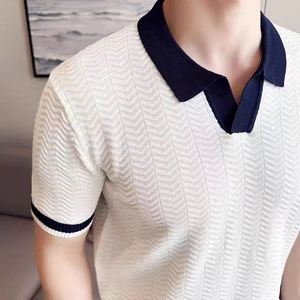 Detail of slim-fit knitted men's polo shirt with textured chevron pattern and contrast cuffs