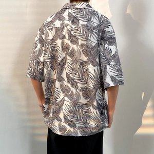 Oversize Hawaiian short sleeve shirt with tropical palm leaf print and relaxed fit