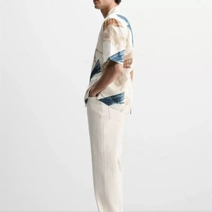 Men's summer casual set with abstract art print shirt and cream straight-leg trousers