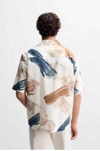 Detail of artistic oil painting print on men's vintage short-sleeved cotton linen shirt