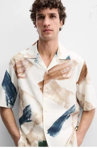 Detailed view of abstract brushstroke print on men's relaxed-fit Cuban collar shirt
