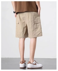 Rear view of khaki quick-dry cargo shorts with large pockets and elastic waist for men