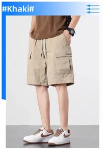 Detail of khaki cargo shorts with elastic waist and large side pockets with lettering