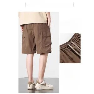 Detail of khaki cargo shorts showing elastic drawstring waist and ice silk tech fabric