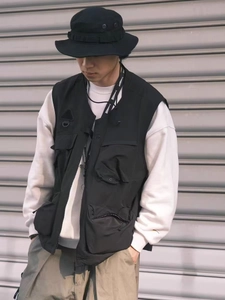 Detail view of functional multi-pocket tactical vest with high-quality zipper and buckle