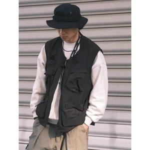 Men's black multi-pocket tactical utility vest with a matching outdoor fisherman hat
