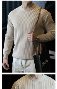 Detail of beige vertical stripe knit sweater featuring ribbed collar and luxury texture