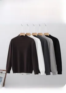 Detail of ribbed knit sweaters in coffee, white, grey, and black with a high neck design