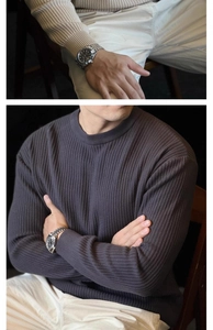 Close-up of ribbed knit texture and cuff details on a crewneck long-sleeved sweater