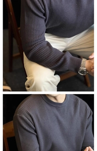 Detailed close-up of dark grey vertical stripe knit texture and crewneck on men's sweater