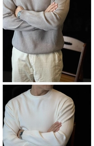 Detailed knit texture and ribbed collar on men's striped long sleeve crewneck sweater