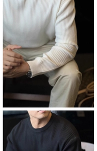 Detail of vertical ribbed knit texture and crew neck on black and white sweaters