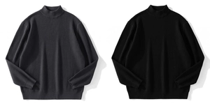Detailed view of vertical rib knit texture on dark gray and black turtleneck sweaters