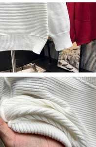 Détail des poignets côtelés et de la texture douce du pull en maille blanc pour homme