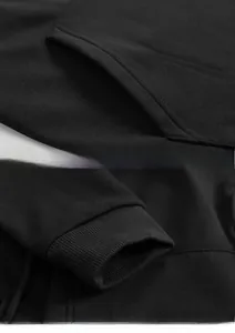 Detail of black cloak hoodie featuring durable double-stitch seams and ribbed cuffs finish