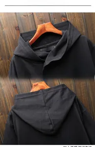 Detail shot of the neckline and hood structure on this black hooded assassin cloak jacket