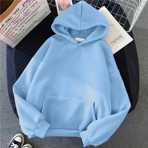 Light blue oversized hoodie with kangaroo pocket and ribbed cuffs in a flat lay style