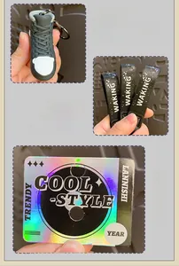Detail of high-top sneaker keychain with black WAKING silicone strap and 3D design
