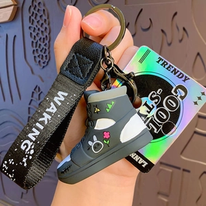 Graffiti sneaker keychain with pink flower rabbit pattern and black logo wrist strap