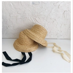 French style children's raffia sun hat with black and cream decorative ribbons