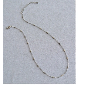 Minimalist silver chain necklace with rectangular beads and adjustable lobster clasp closure