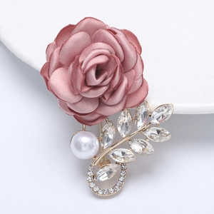 Elegant dusty pink fabric rose brooch with gold alloy leaves and sparkling rhinestones