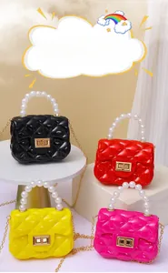 Quilted mini jelly bags in four colors with pearl handles and gold chain straps