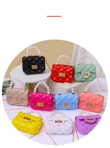 Collection of colorful mini jelly bags with pearl handles and quilted textures
