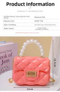 Detailed view of pink quilted jelly bag with white pearl handle and metal lock