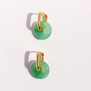U-shaped gold earrings with green natural stone pendants on a clean white background
