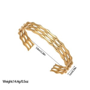 Detailed view of gold bamboo-style open bangle with dimensions 5.8cm diameter and 1cm width