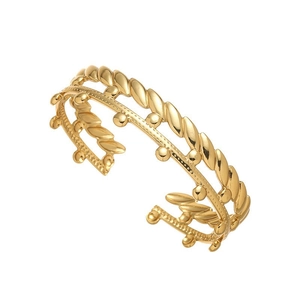 Close-up of double-layered gold bracelet with twisted rope and bead details