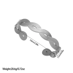 Detailed view of silver infinity twist bangle with dimensions 5.8cm diameter and 1.1cm width