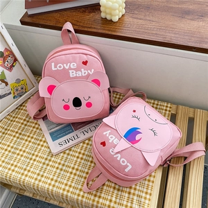 Close-up of pink canvas toddler backpacks with cute koala and Love Baby prints
