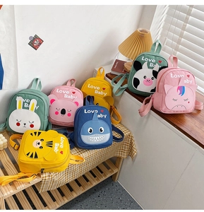 Detailed view of various colorful cartoon animal canvas backpacks for kids featuring Love Baby