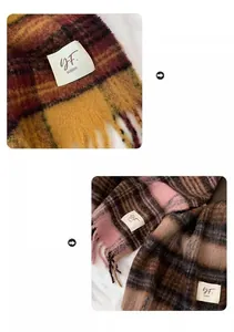 Close-up of soft plaid scarves with fringe tassels and woven label on fabric