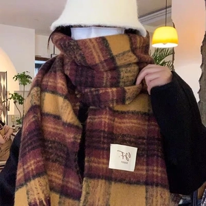 Thick vintage plaid scarf with mustard and burgundy checks and a minimalist logo tag