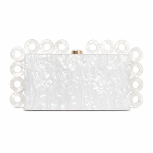 Macro detail of white marble acrylic evening clutch with gold clasp and ring handle