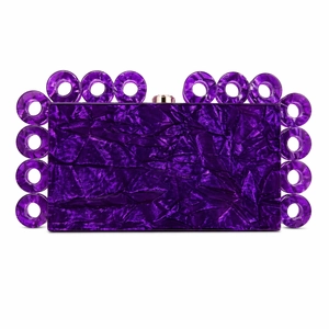 Detail of deep purple acrylic evening bag with gold metal clasp and ring ornaments